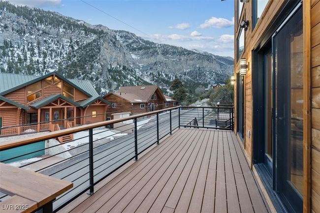 Snow covered deck featuring a mountain view | Image 80