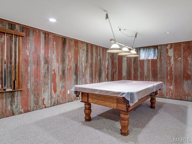 Game room featuring carpet, barnwood walls, billiard table, and recessed lighting | Image 26