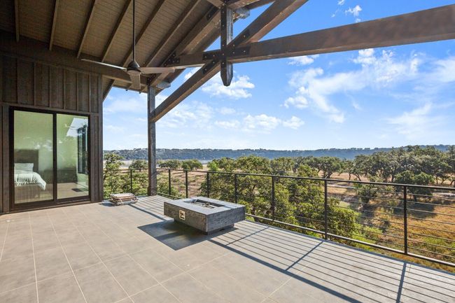 Sweeping, uninterrupted views of the shimmering water and picturesque hill country are available from the balcony. | Image 16