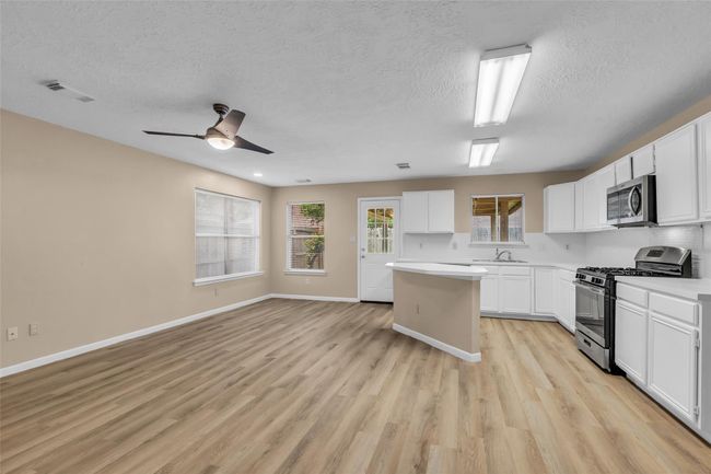 Kitchen is open to breakfast area and formal dining. | Image 15