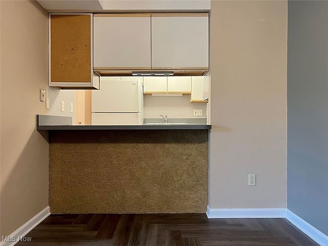Kitchen, white cabinets, a peninsula, and ample countertops | Image 6