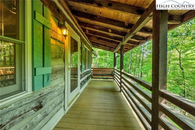 A timeless front-porch swing invites you to sway along with the birds' melodies. | Image 26