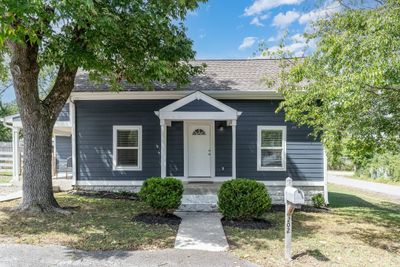 You walk up to this adorable and shaded front porch | Image 2