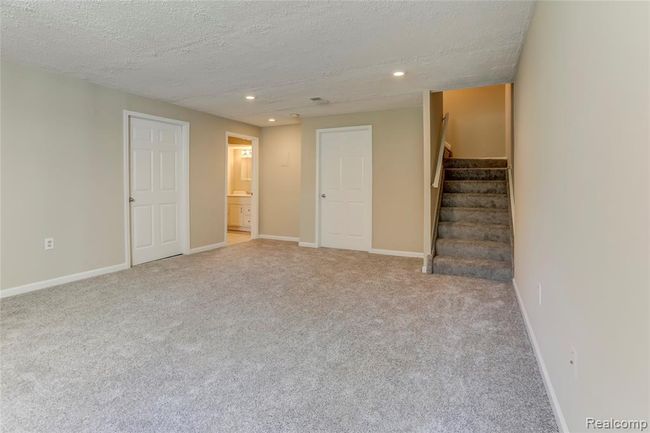 Finished lower level with full bath and 2 storage closets. | Image 19