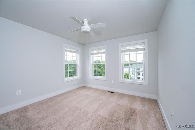 room featuring light colored carpet and ceiling fan | Image 16