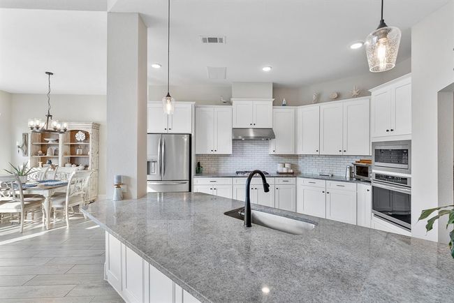 Huge island w/ lots of counter space throughout kitchen | Image 24