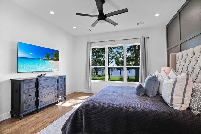 Bedroom with recessed lighting, visible vents, and light wood-type flooring | Image 17