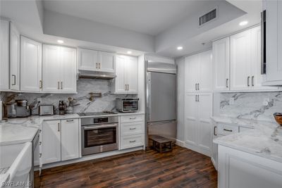 Every upgrade from bi-level pantry to spice rack in drawers, enjoying even the pot filler and wifi stove and dishwasher! | Image 2