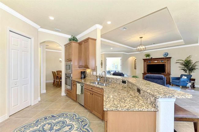 Honey-Glazed Maple Cabinetry, Stainless and Granite Counters | Image 25