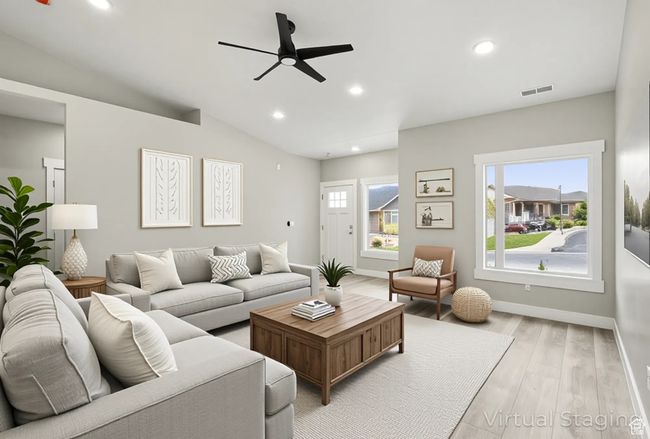 Living room featuring a ceiling fan, light wood-style floors, recessed lighting, baseboards, and vaulted ceiling | Image 9