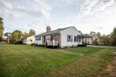 Side view, driveway on Jonathan Place. Carport | Image 2