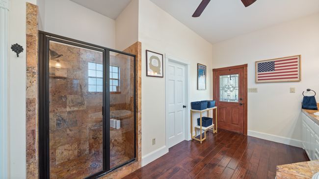 Entryway featuring dark wood-type flooring, ceiling fan, and baseboards | Image 21