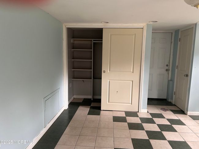 Storage closet in huge family room. | Image 28