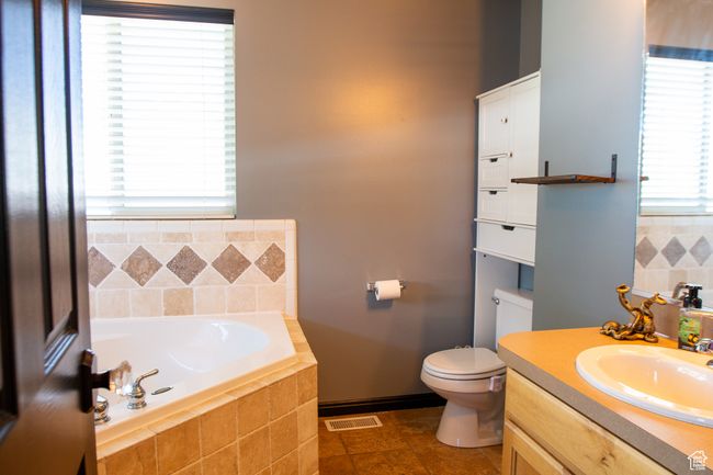 Primary Full bath featuring a garden tub, shower, bidet toilet, and vanity | Image 14