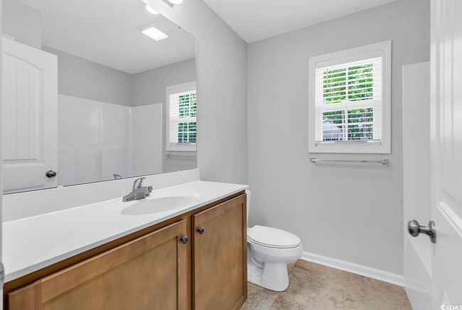 Bathroom with baseboards, toilet, and vanity | Image 18