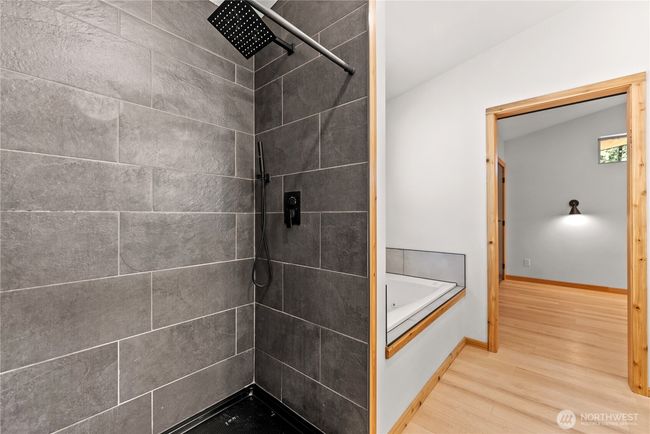 Walk in tiled shower off of primary bedroom. | Image 26