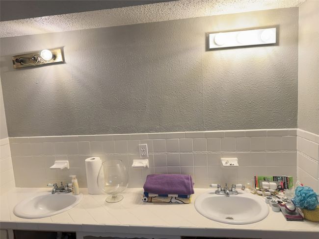 Bathroom with vanity and tile walls | Image 14