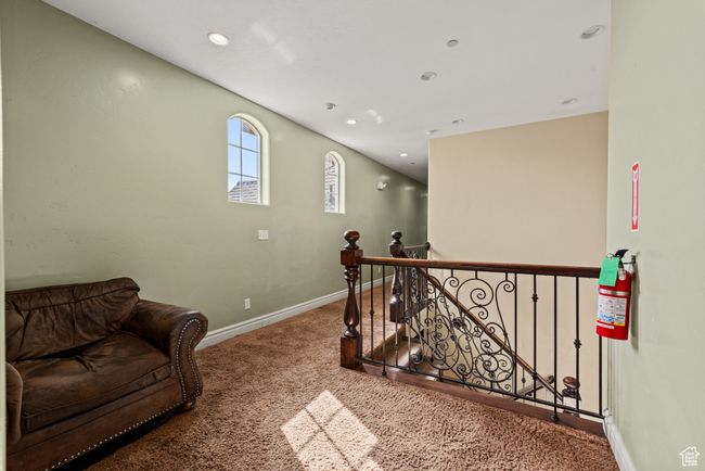 Interior space with recessed lighting, baseboards, an upstairs landing, and carpet floors | Image 37