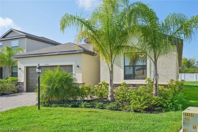 View of front of property with a garage and a front yard | Image 2