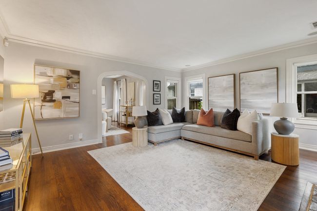 Spacious living room flows seamlessly into the dining room | Image 12