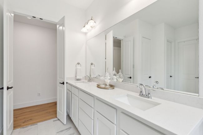 Dual sinks with gleaming quartz countertops | Image 17