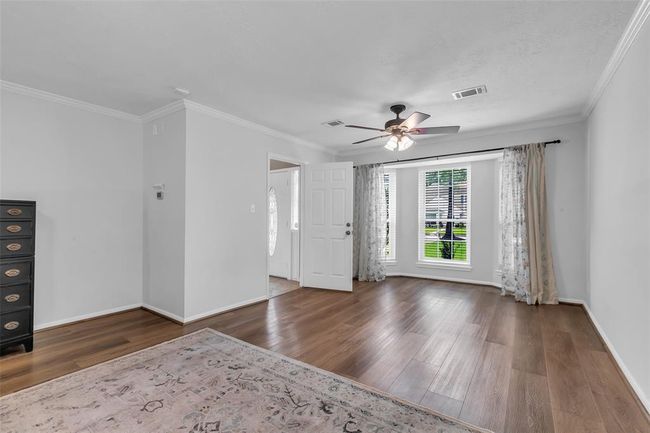 The spacious sitting area in the primary bedroom offers flexibility for a cozy reading nook, home office, or nursery. | Image 25