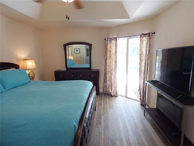 tray ceiling with fan, direct access to the lanai and pool area | Image 37