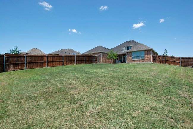 View of yard featuring a fenced backyard | Image 37