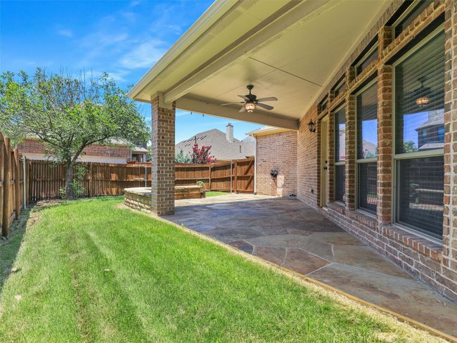 Fenced backyard featuring a patio and a ceiling fan | Image 34