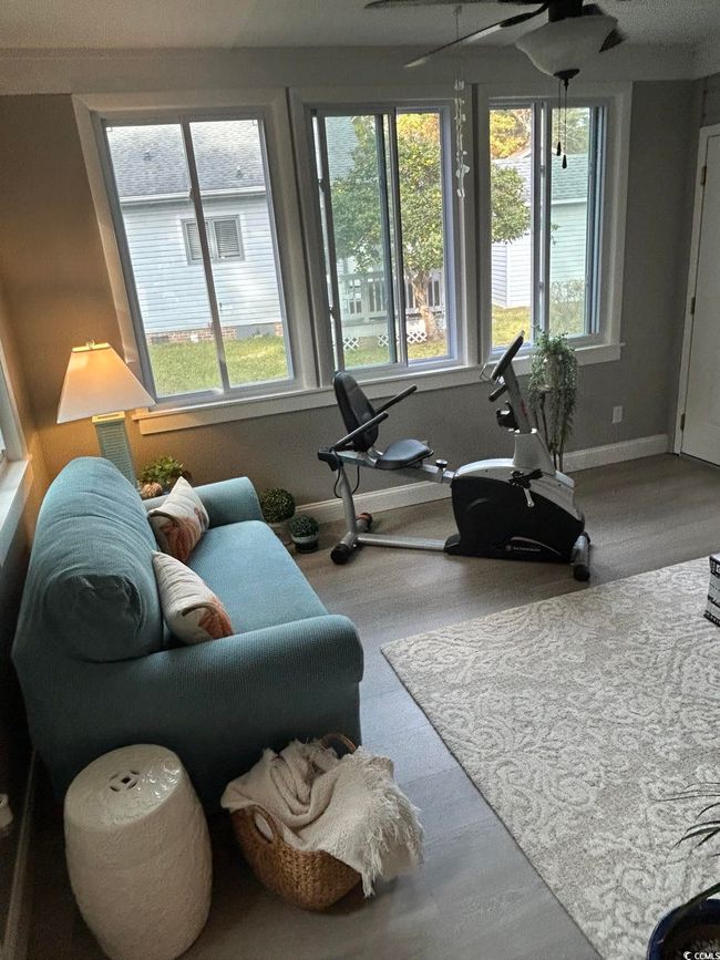 Exercise area featuring baseboards and a ceiling fan | Image 25