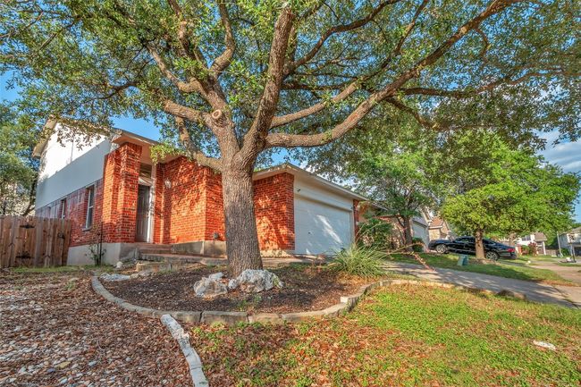 View of property exterior with a garage and brick siding | Image 28