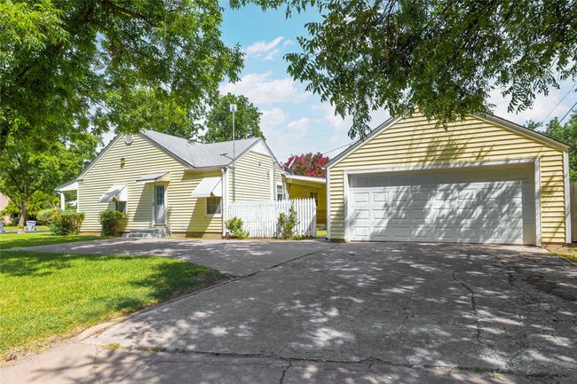 Single story home featuring a garage and entry steps | Image 39
