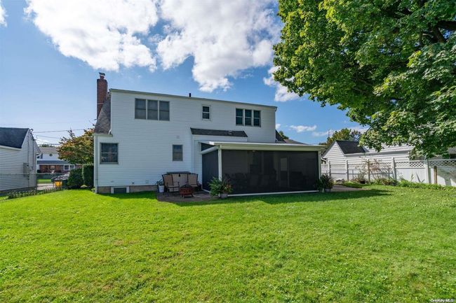 Back yard looking at house with Life Room screens DOWN | Image 23