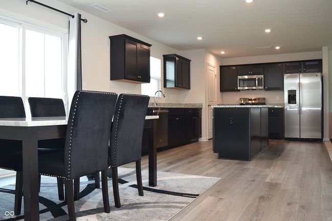 view from back hall of dining area and kitchen | Image 23