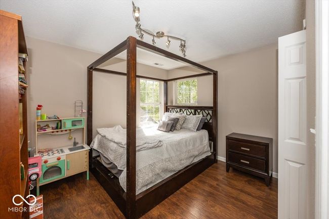bedroom featuring wood finished floors | Image 20