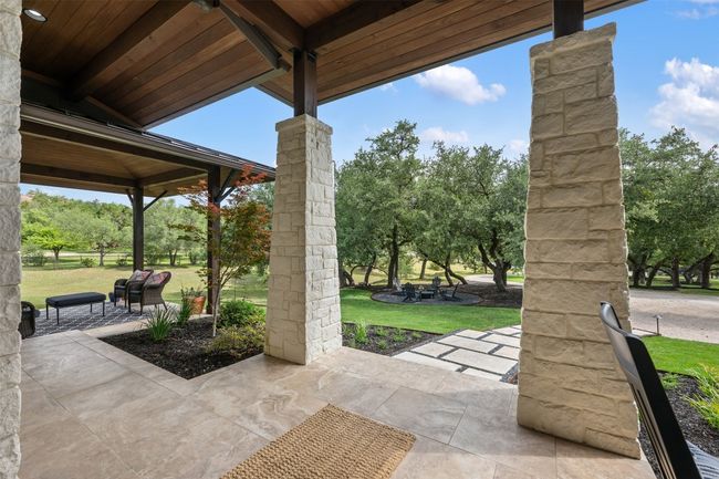 View of patio with view of wooded area | Image 31