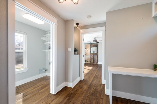 From the built-in work space there is access to the laundry room which is located conveniently next to the primary suite | Image 16