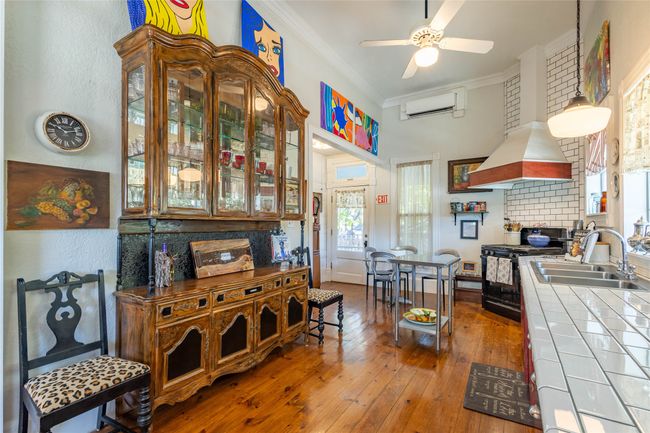 Eclectic Kitchen features Gas stove, built in refrigerator, 3 tier stainless sink for Food safety compliance and room for comnversations and gathering | Image 8