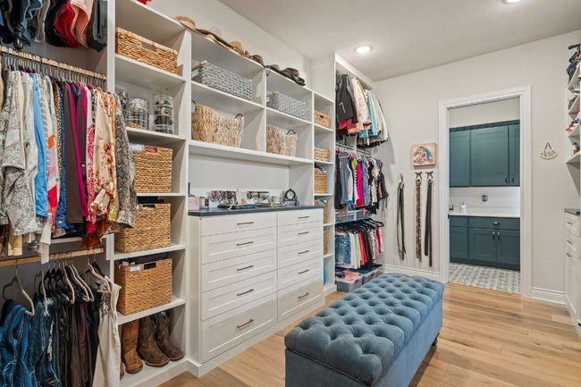 Spacious closet featuring light wood-style flooring | Image 32