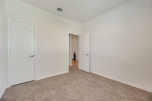 Unfurnished bedroom featuring light carpet and baseboards | Image 27