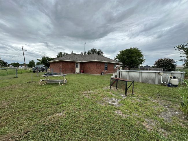 View of yard featuring an outdoor pool | Image 20