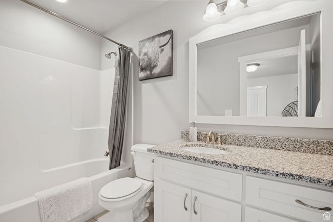 Full bath featuring vanity and shower / bathtub combination with curtain | Image 16