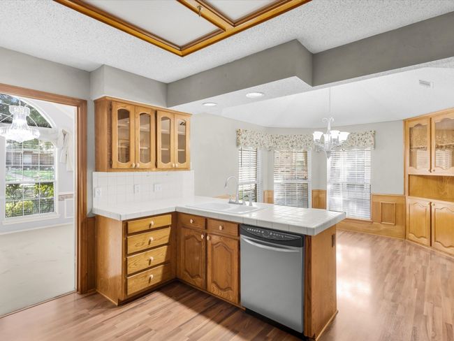 Glass Door Cabinets and Built-In in Dining Area allows for displaying beautiful dishes or China. | Image 19