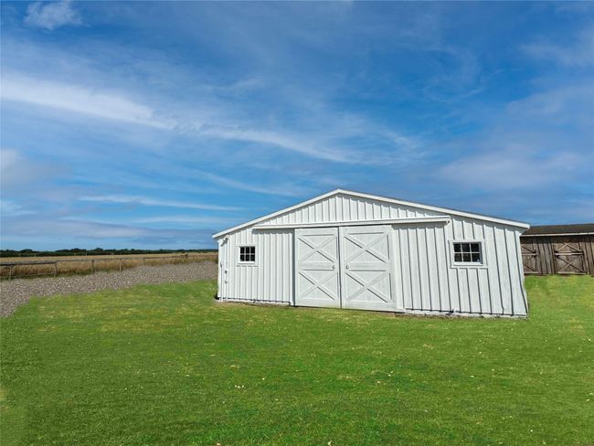 View of pole building featuring a lawn | Image 7