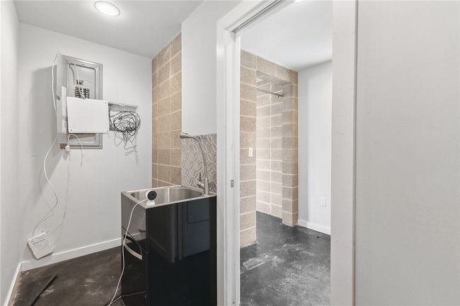 Bathroom featuring concrete flooring | Image 34