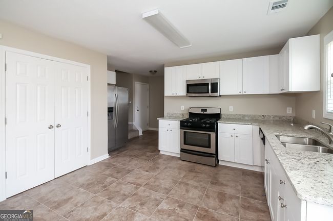 7144 Caspian Dr, House other with 7 bedrooms, 3 bathrooms and null parking in Fairburn GA | Image 7