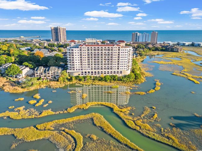 Bird's eye view of a nearby body of water and apartment complex / building | Image 38