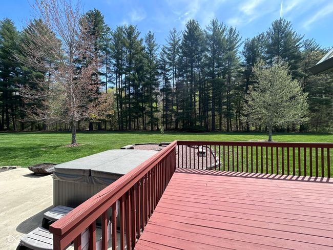 deck with a lawn and a hot tub | Image 13