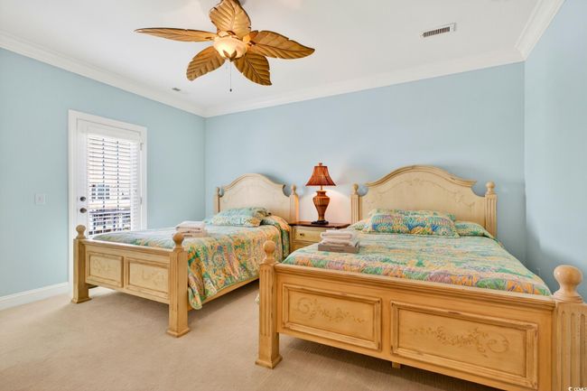 Bedroom featuring crown molding, light carpet, and a ceiling fan | Image 19