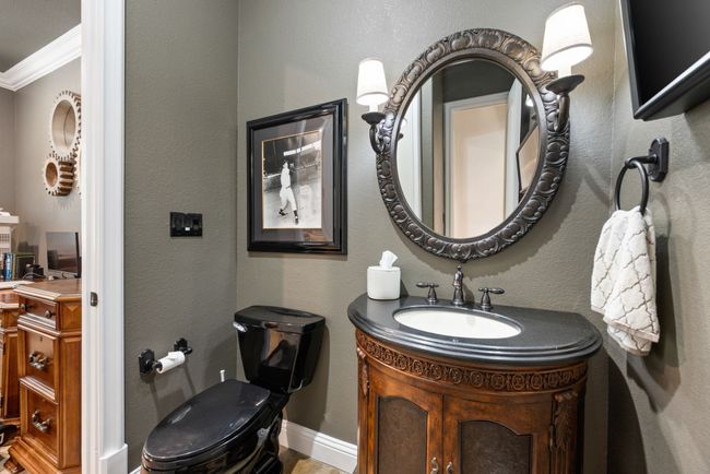 The guest bath can entered through the hall or the study. The builder says it is plumbed for a future shower inside the linen closet. | Image 22